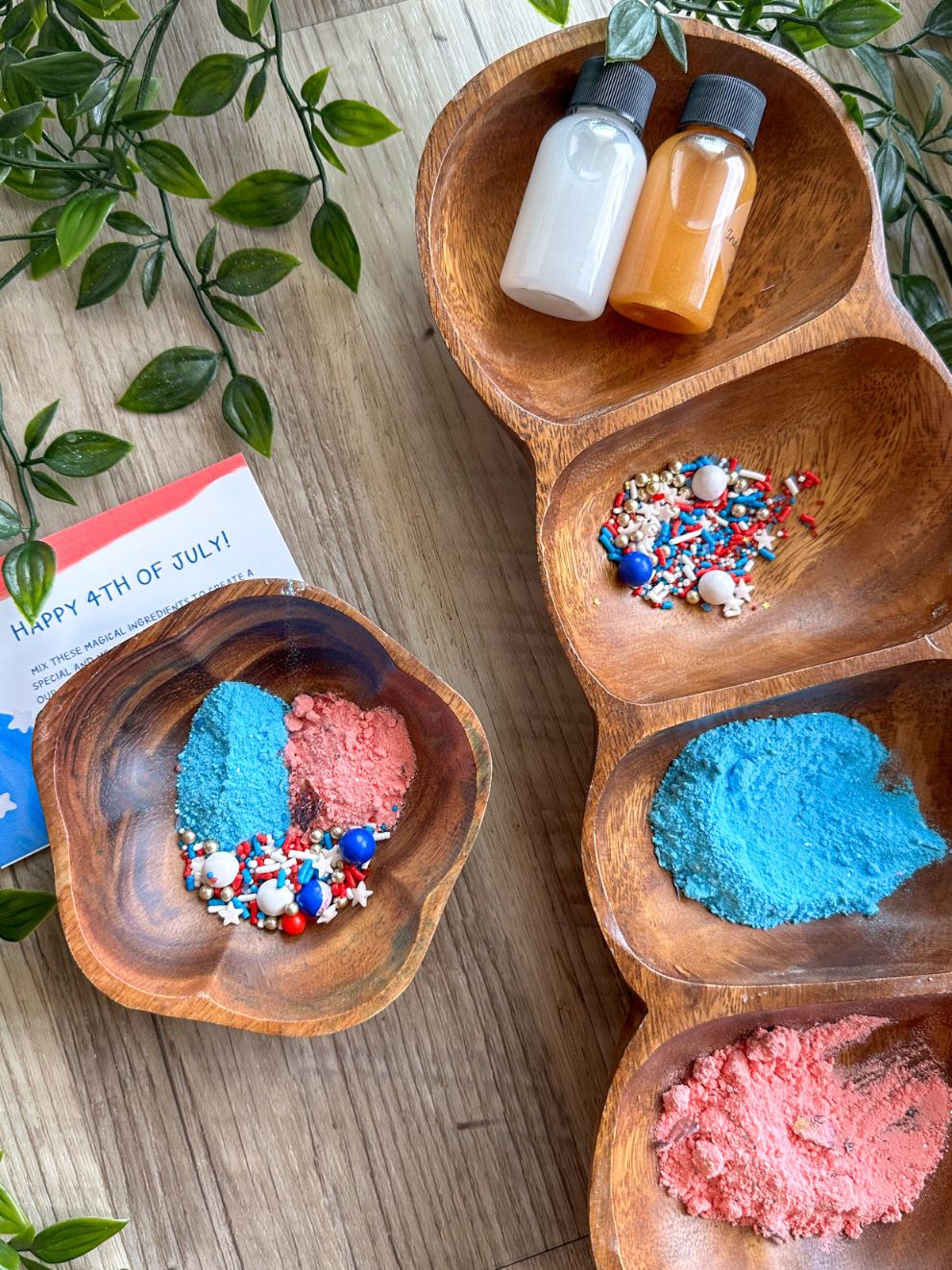 Fourth of July themed sensory potion play kit ingredients in wooden bowls