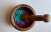 Video of colorful children's sensory potion kit bubbling in wooden bowl